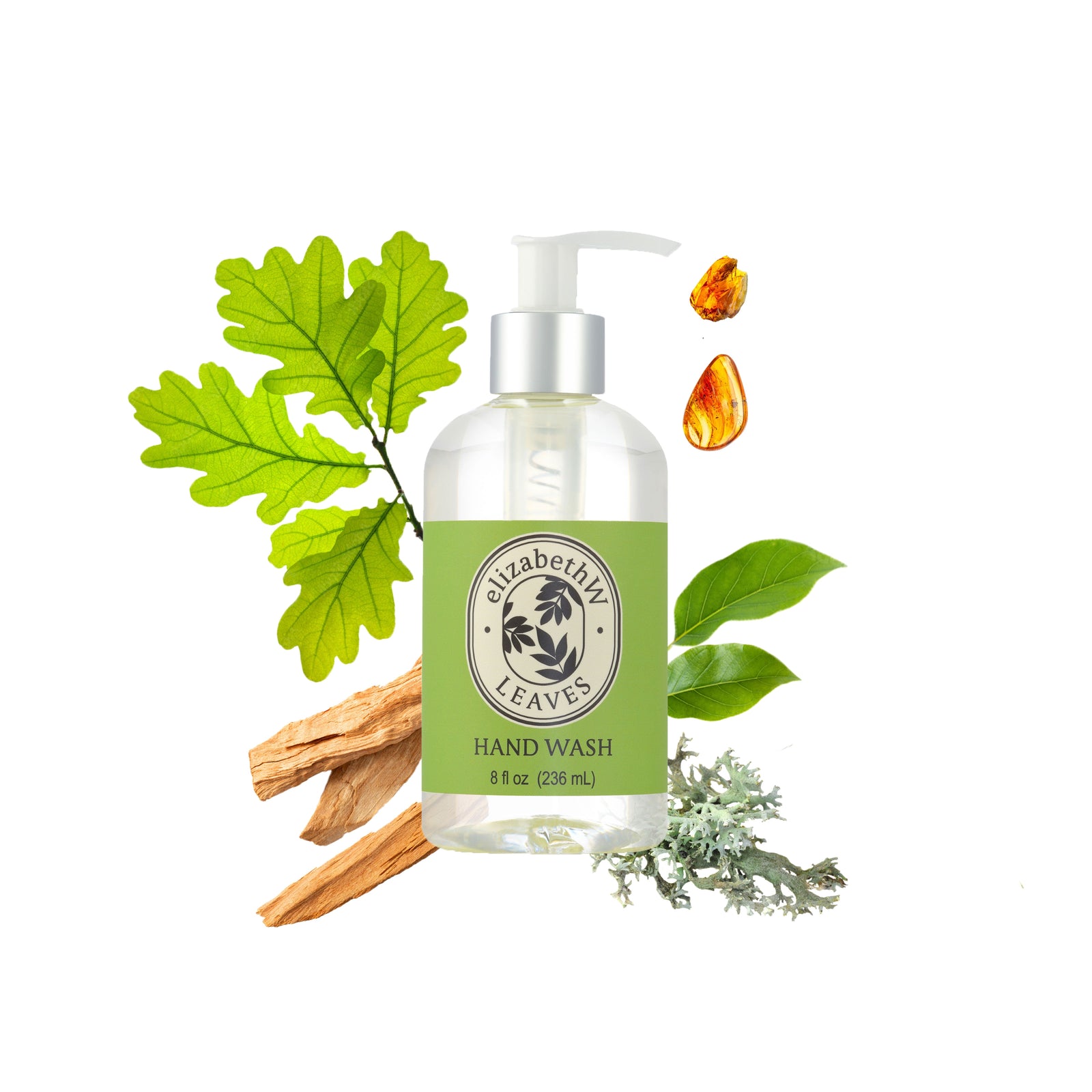 Close-up of sunlit green oak leaves with drops of water hanging from some of them. The background is a soft blur of similar foliage, creating a serene forest atmosphere.