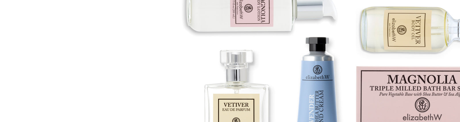 A decorative setup on a marble surface includes a pink peony flower, a lit candle in a glass jar, and a reed diffuser in a bottle with long wooden sticks, all labeled "ElizabethW Peony.