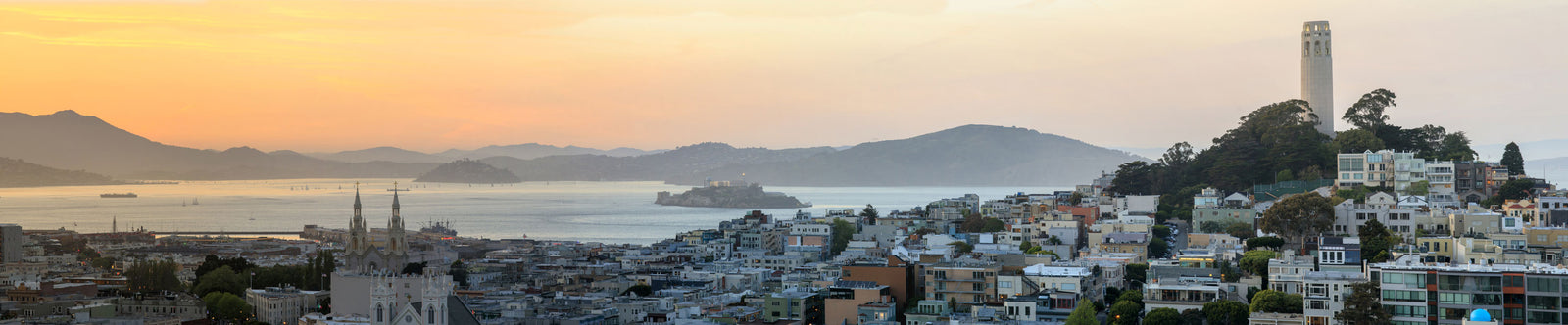 Panoramic view of San Francisco skyline at sunset
