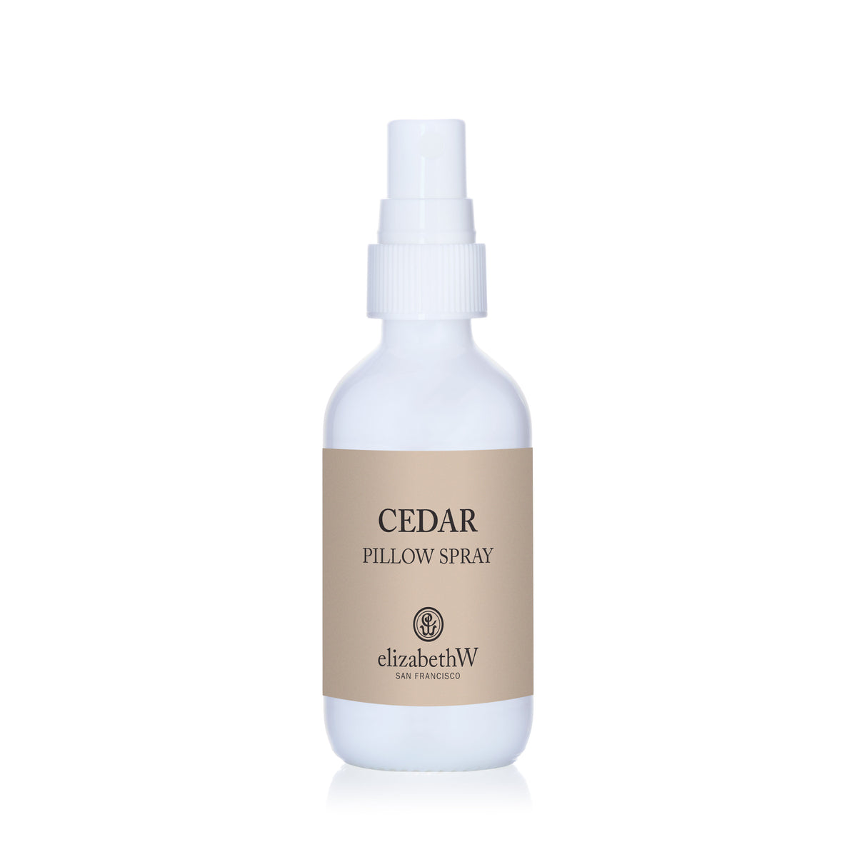 White spray bottle with a beige elizabethW Cedar Pillow Spray label.