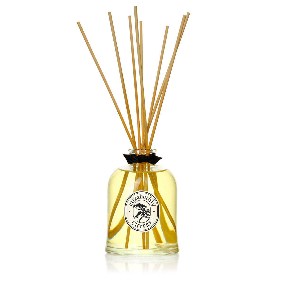 The elizabethW Chypre — Diffuser is a clear glass bottle with yellow liquid and long reed sticks, releasing a lasting fragrance to refresh your space.