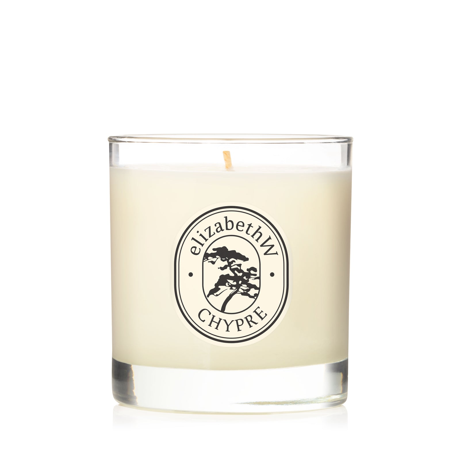 A hand-poured white Chypre — Perfume Candle by elizabethW in a clear glass holder with a single wick, featuring a round "elizabethW CHYPRE" label and tree illustration, set against a plain white background.