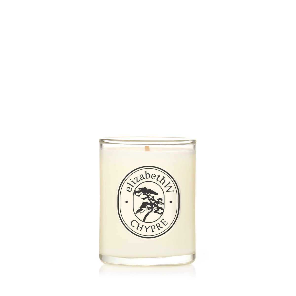 A hand-poured soy candle from elizabethW, named Chypre — Petite Perfume Candle, in a clear glass holder with a label featuring the brand, product name, and a small tree graphic inside an oval border.