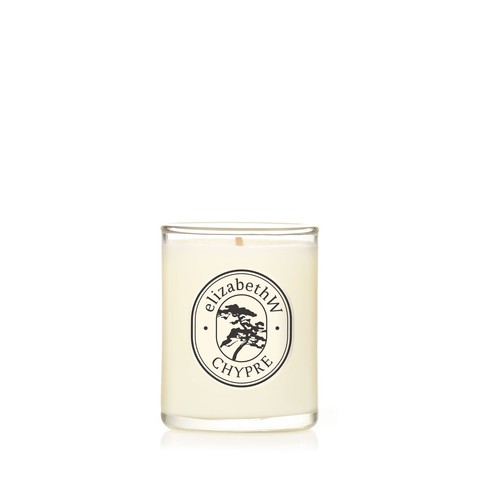 A hand-poured soy candle from elizabethW, named Chypre — Petite Perfume Candle, in a clear glass holder with a label featuring the brand, product name, and a small tree graphic inside an oval border.