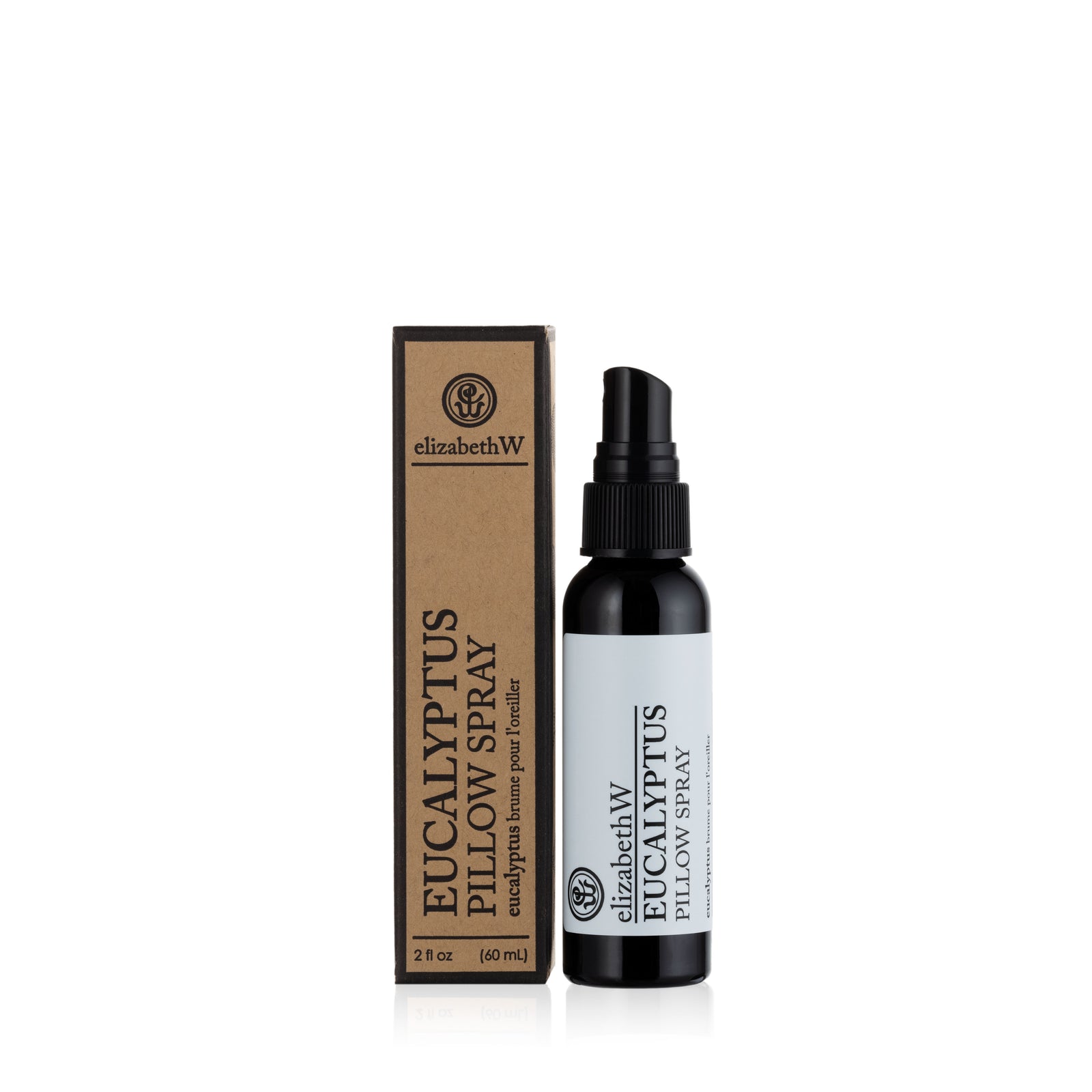 An elizabethW Eucalyptus — Pillow Spray bottle, featuring a spray nozzle, stands beside its matching brown box. Both the black bottle and the packaging showcase the product name “Eucalyptus — Pillow Spray” and brand “elizabethW” in bold black text. Crafted with essential oils, this soothing pillow mist offers a calming eucalyptus aroma to enhance your bedtime routine.