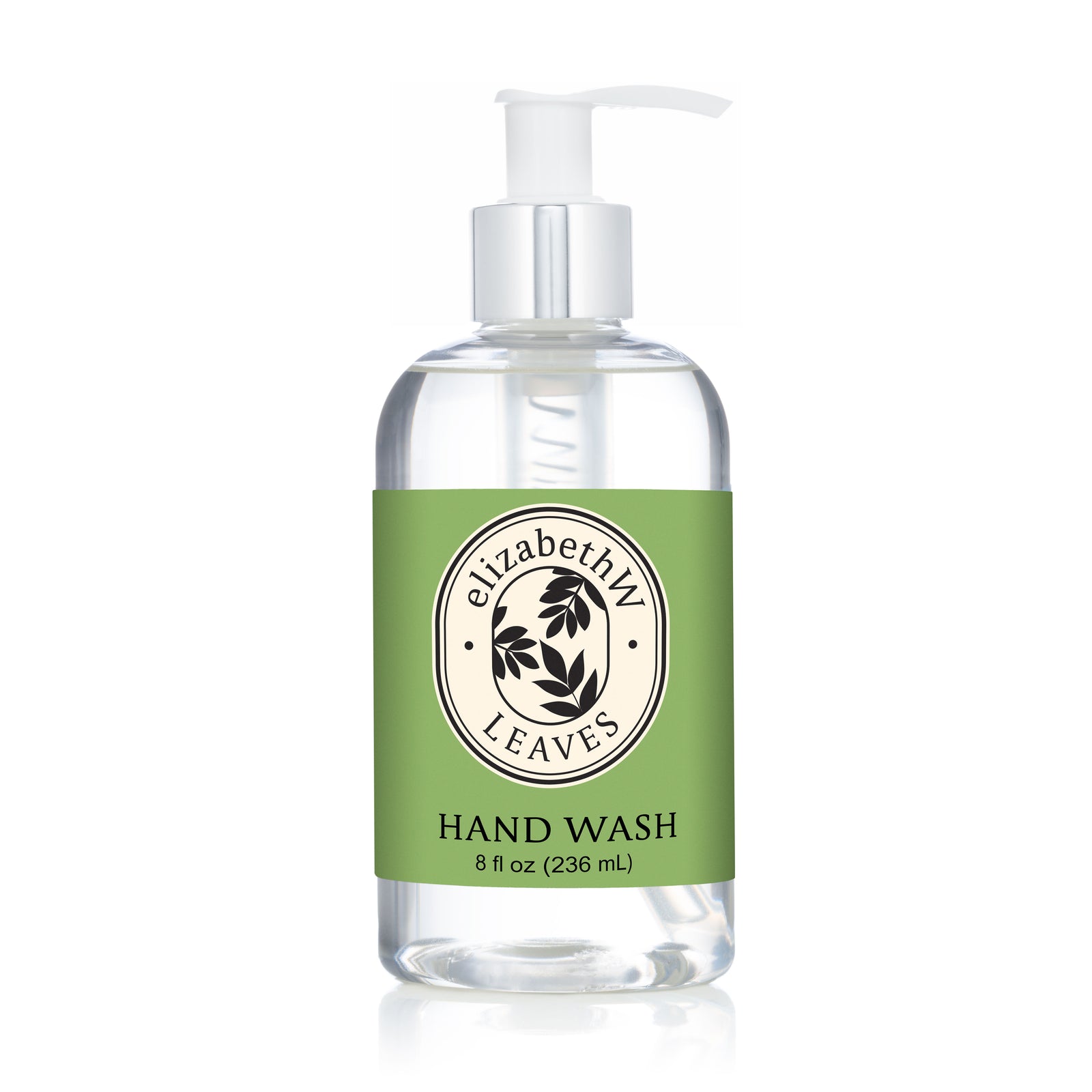 A clear pump bottle labeled "E Wightman & Co Leaves — Hand Wash 8 fl oz (236 mL)" with a green label, black text, and a circular leaf logo in the center, infused with soothing aloe vera.