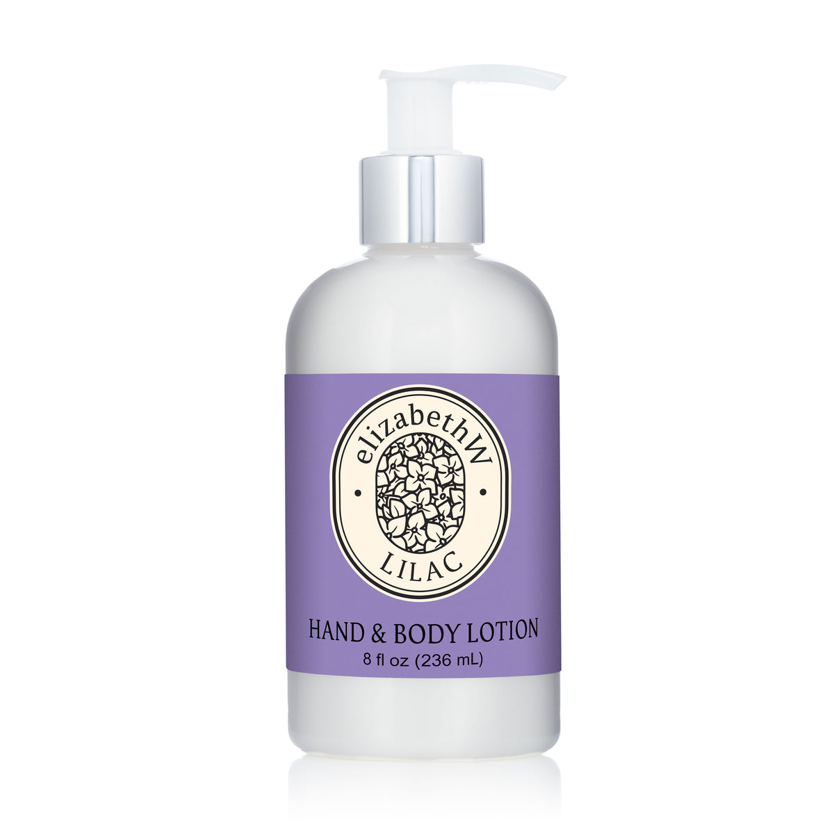 A white pump bottle labeled "Lilac — Hand & Body Lotion" by E Wightman & Co features a purple label, floral logo, and delivers a soothing lilac scent in nourishing shea butter lotion.