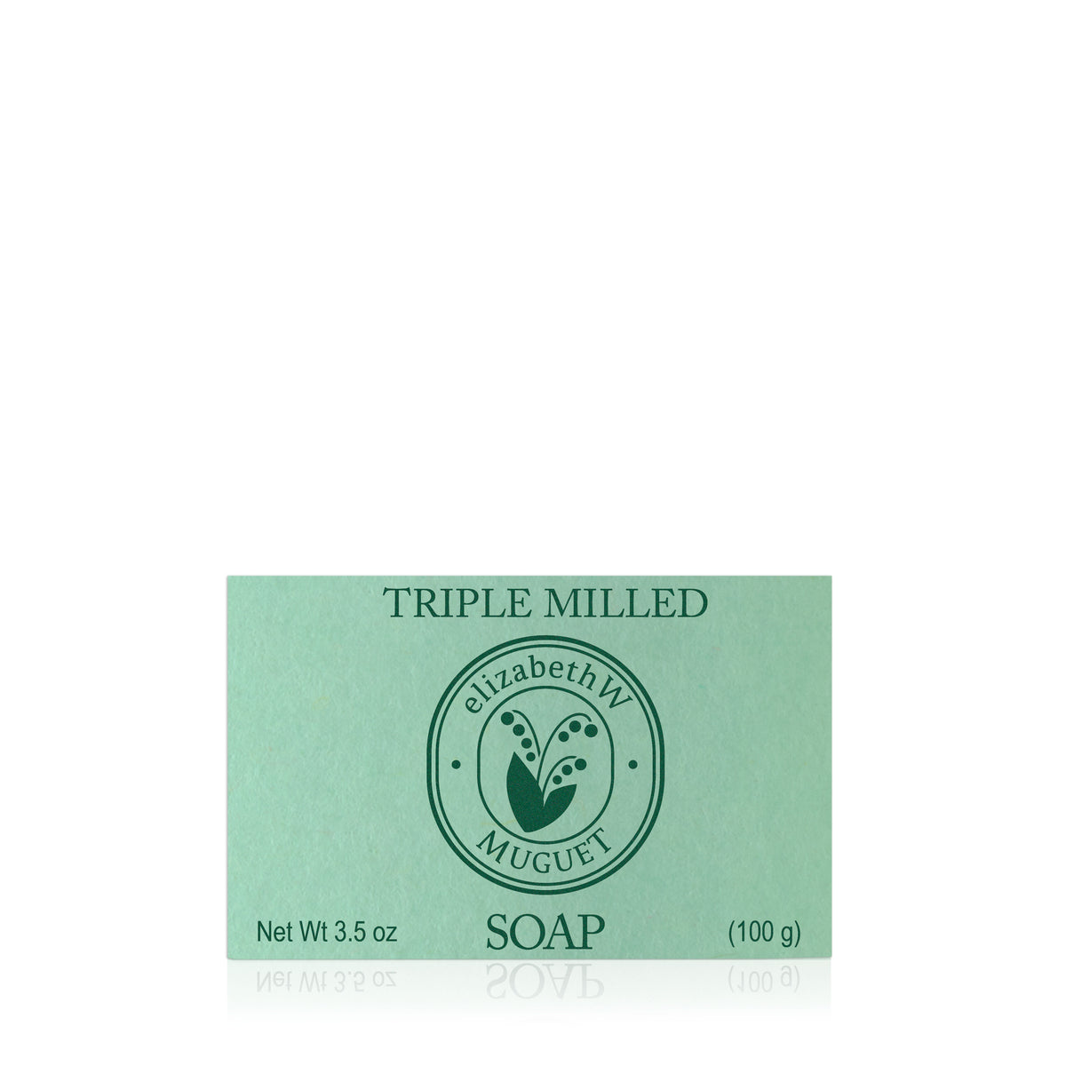 A green rectangular bar of elizabethW’s Muguet — Triple Milled Soap, weighing 3.5 oz (100 g), features a circular floral logo in the center and is labeled "TRIPLE MILLED elizabethW Muguet SOAP." This soap evokes the delicate fragrance of lily of the valley.