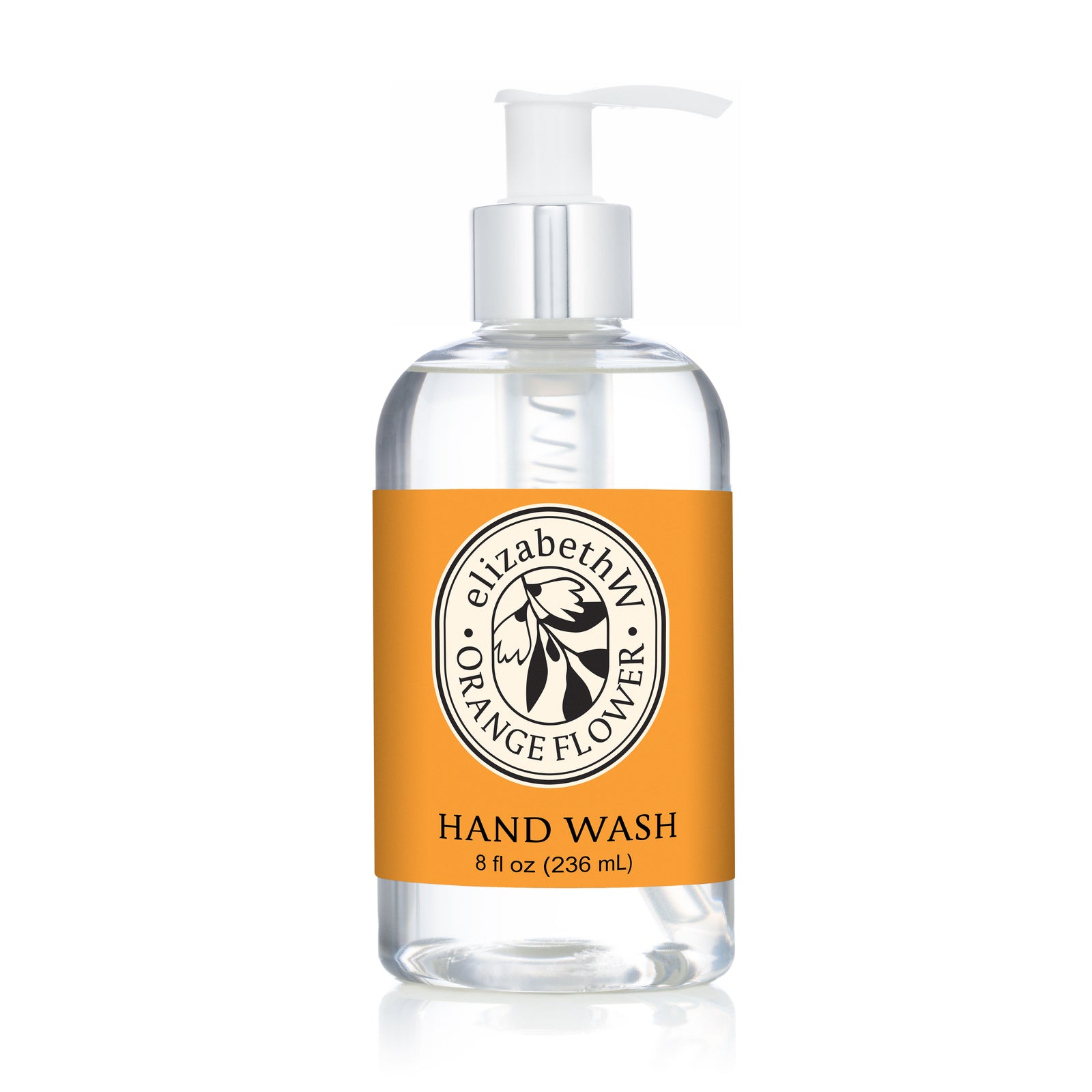 A clear pump bottle labeled "E Wightman & Co Orange Flower — Hand Wash 8 fl oz (236 mL)" features an orange label with a floral logo, offering refreshing botanical care for your daily hand washing routine.