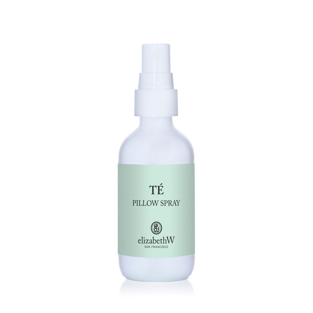 A white elizabethW Té Pillow Spray bottle with a light green label and the brand logo.