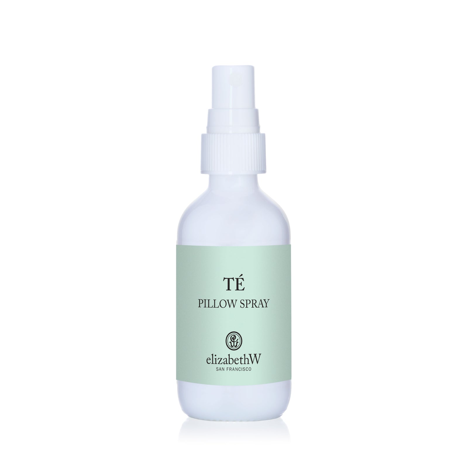 A white elizabethW Té Pillow Spray bottle with a light green label and the brand logo.