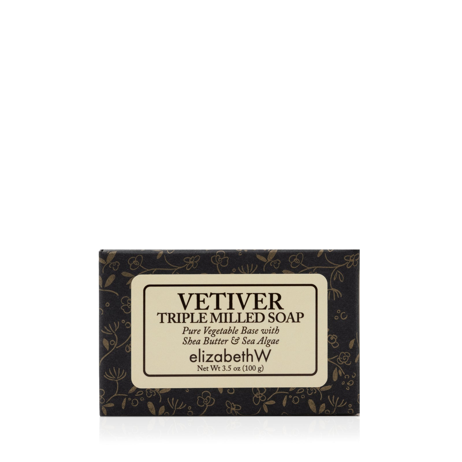 A 3.5 oz (100g) bar of elizabethW’s Vetiver — Triple Milled Soap, presented in black floral packaging, is crafted from a pure vegetable base with shea butter and sea algae, and made using plant-based ingredients.
