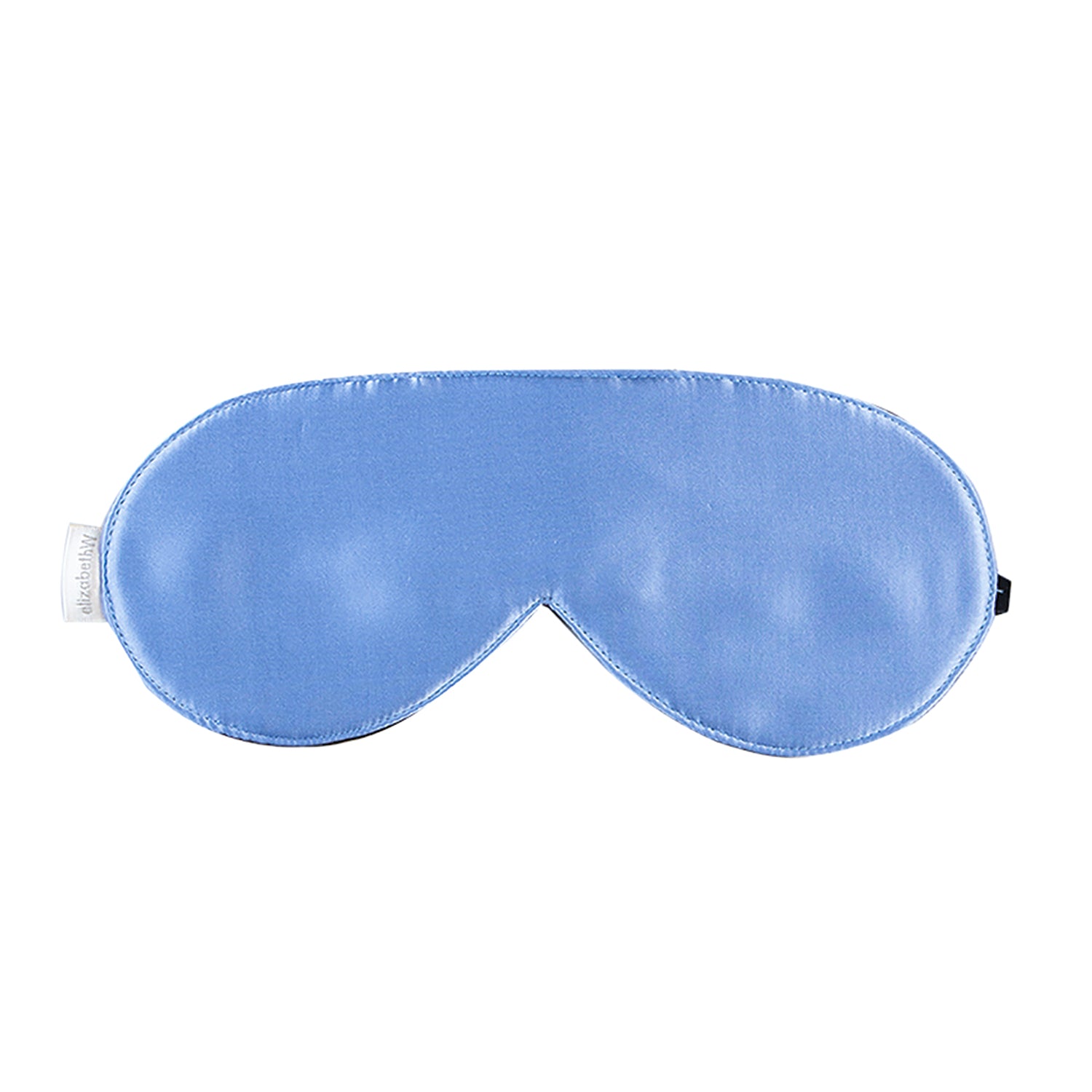 The Periwinkle Sleep Mask from elizabethW is a luxurious light blue sleep mask crafted from luxurious silk, with a smooth satin finish. It includes adjustable strap to ensure it secures comfortably around your head for a restful sleep.