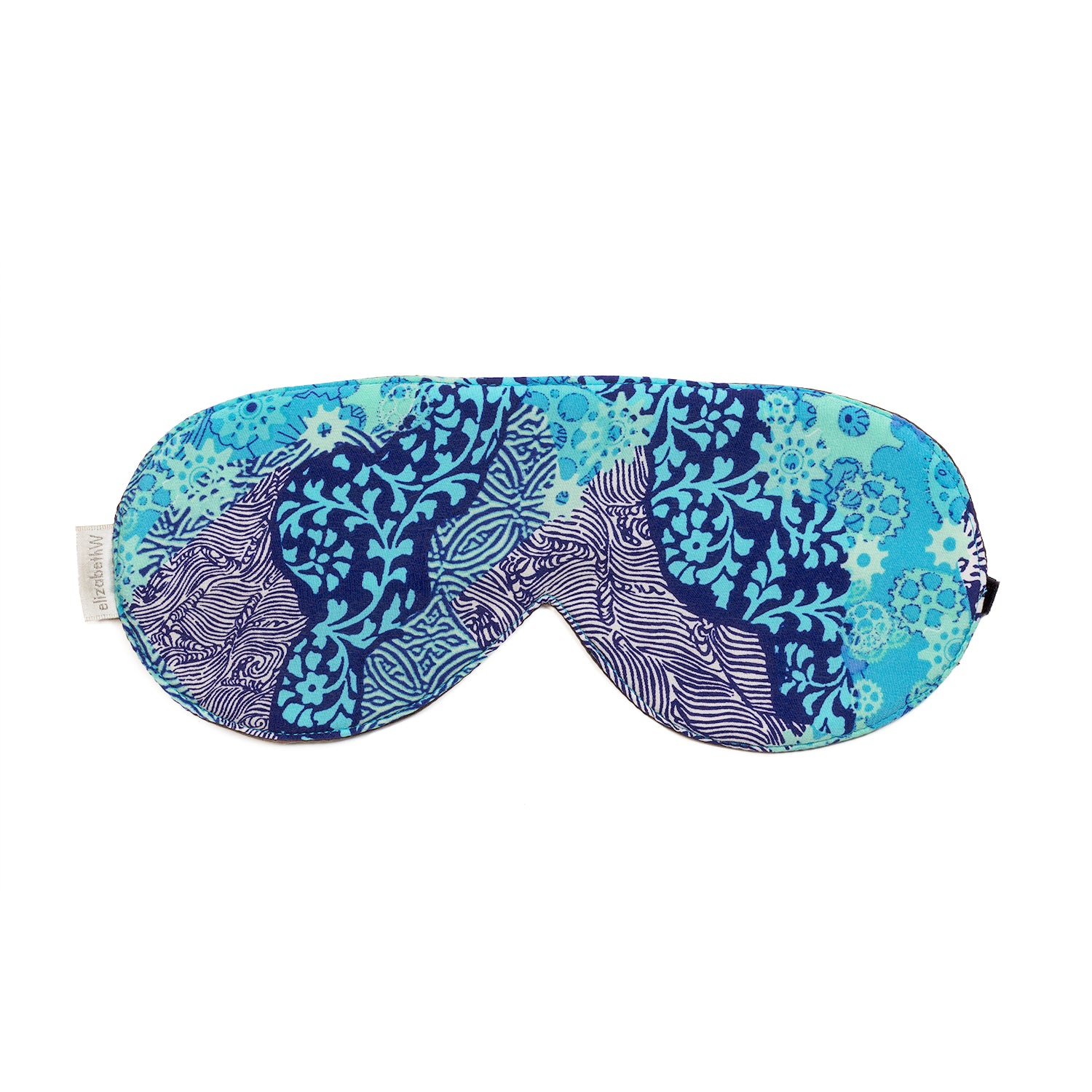 The Aqua Origami Sleep Mask by elizabethW is a luxurious silk sleep mask adorned with a vibrant blue and teal abstract pattern, featuring swirling designs and various shapes. It includes adjustable strap to ensure it secures comfortably around your head for a restful sleep.