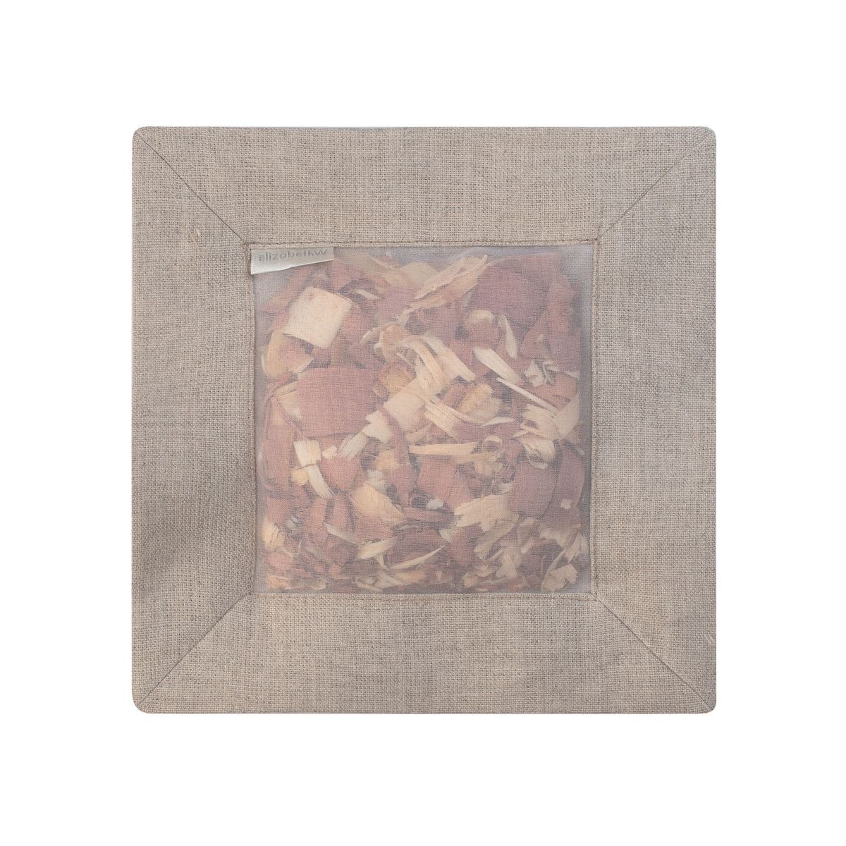 Cedar filled inside of a &quot;natural&quot; colored square sachet with a transparent screen