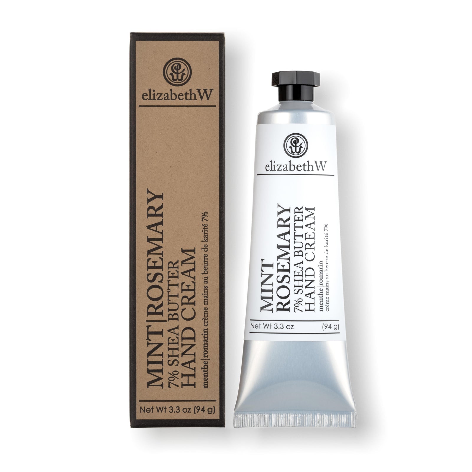 A silver tube of Mint Rosemary 7% Shea Butter Hand Cream, placed next to its matching kraft paper box. The label on the tube and the box reads "elizabethW Mint Rosemary 7% Shea Butter Hand Cream" with the French translation "menthe|romarin crème mains au beurre de karité 7%." The net weight is listed as 3.3 oz (94 g).