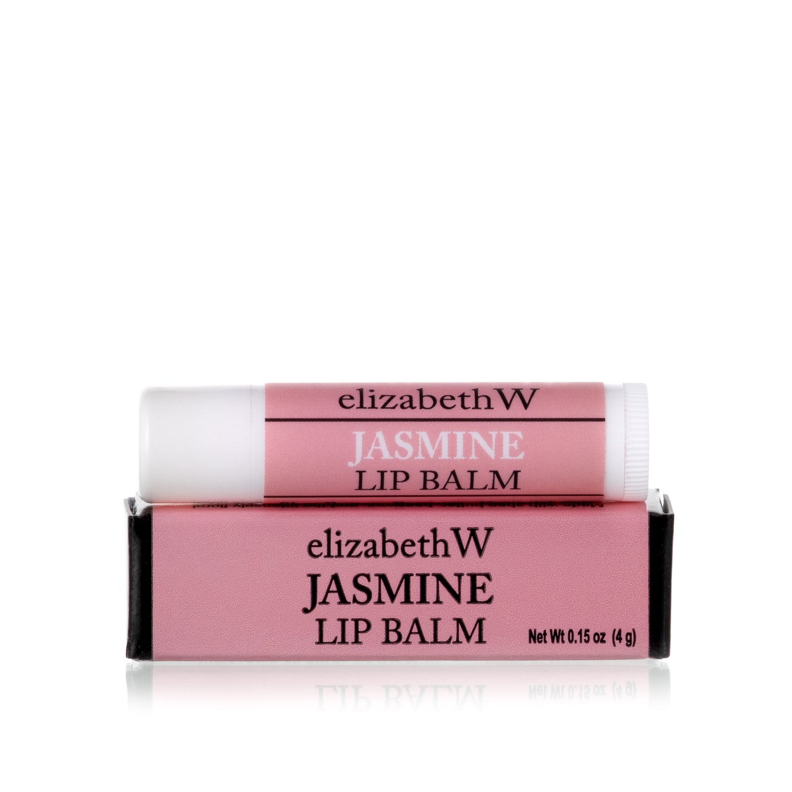 A tube of Jasmine Lip Balm placed on top of its matching pink and black box. The tube and box are both labeled with the product name in black text on a pink background.