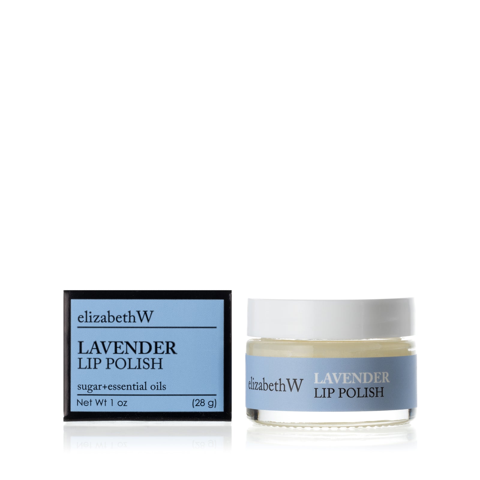 A glass jar of Lavender Lip Polish beside its matching black and blue box. The jar contains a smooth white lip polish with a blue label.