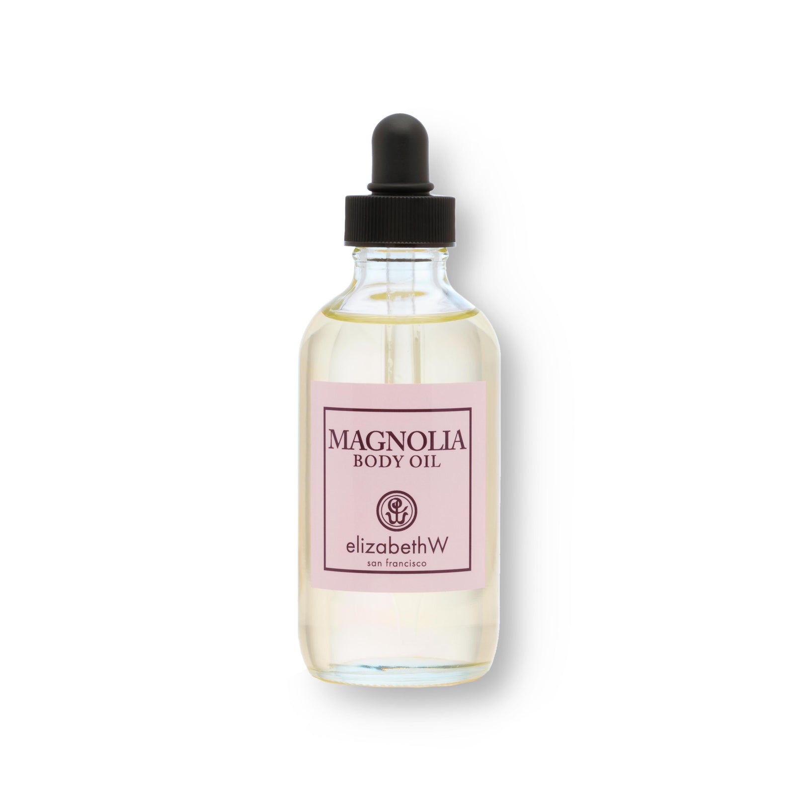 A 4 fl oz (118 mL) glass bottle of body oil with a black dropper cap. The light pink label reads "Magnolia Body Oil" with the elizabethW logo and "san francisco." The clear bottle shows the light-colored oil inside, giving it a sleek and minimalist appearance.