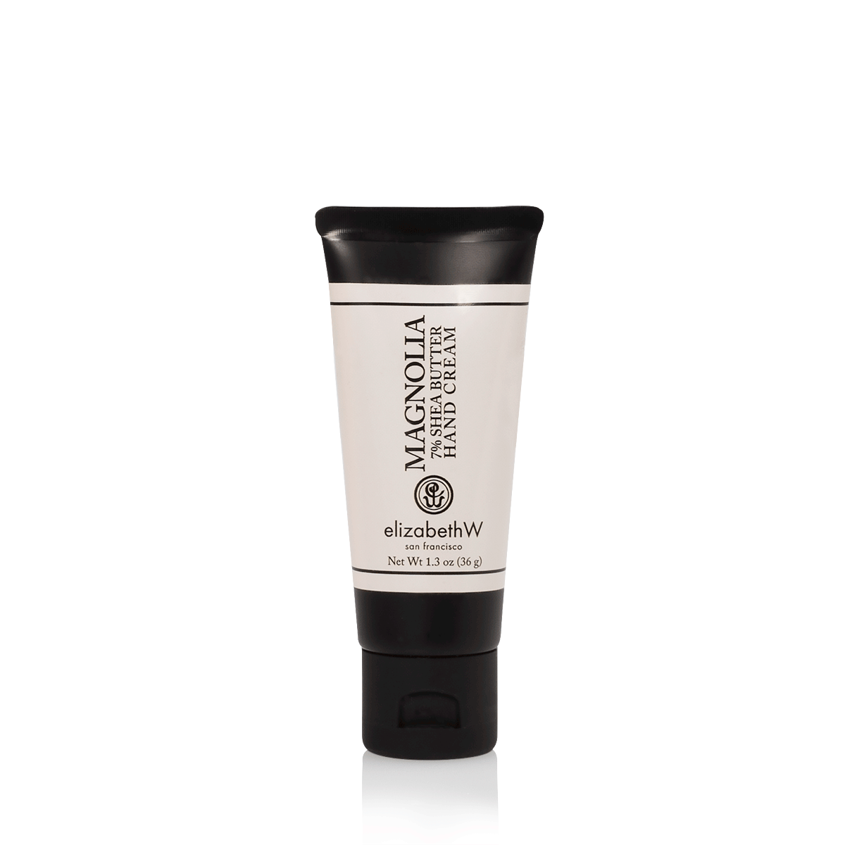 A 1.3 oz (36 g) light pink-colored tube of Magnolia hand cream with a black cap and black text. The label reads "Magnolia 7% Shea Butter Hand Cream," with the elizabethW logo and "san francisco" beneath it. The net weight of the product is also listed on the label.