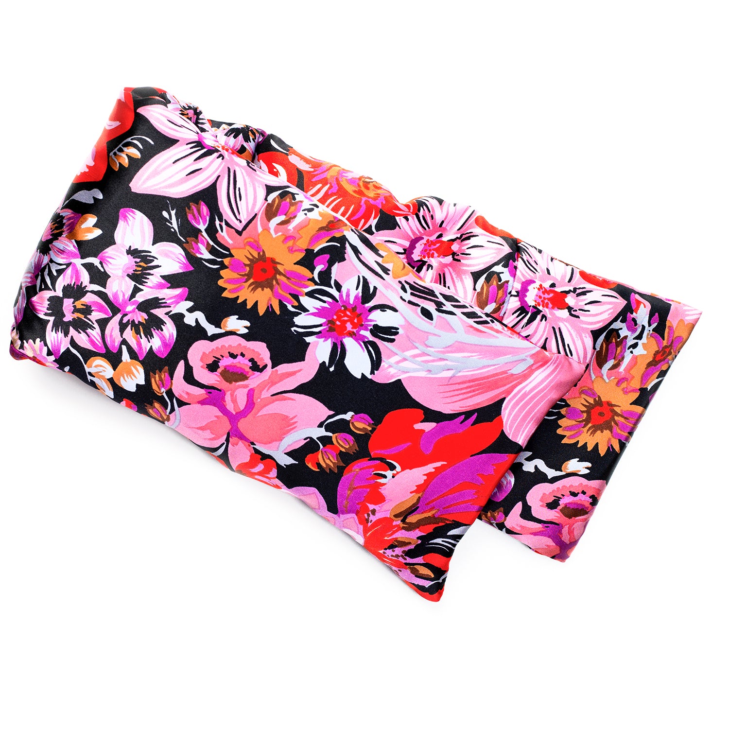 Neatly arranged against a plain white background, the elizabethW Midnight Garden Hot/Cold Flaxseed Pack features a vibrant floral pattern in shades of pink, red, white, and orange on a black background. Covered in a silk casing, and can be used as a heat pad or cold compress.