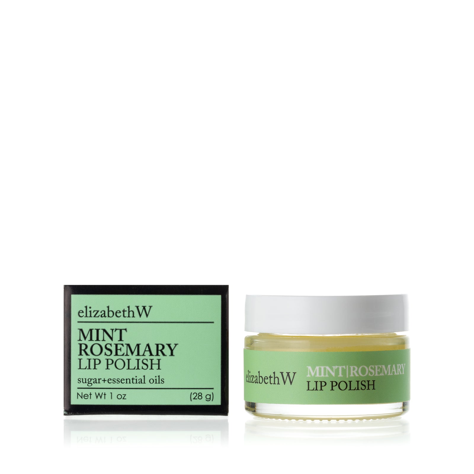 A glass jar of Mint Rosemary Lip Polish beside its matching black and light green box. The jar contains a smooth white lip polish with a light green label.