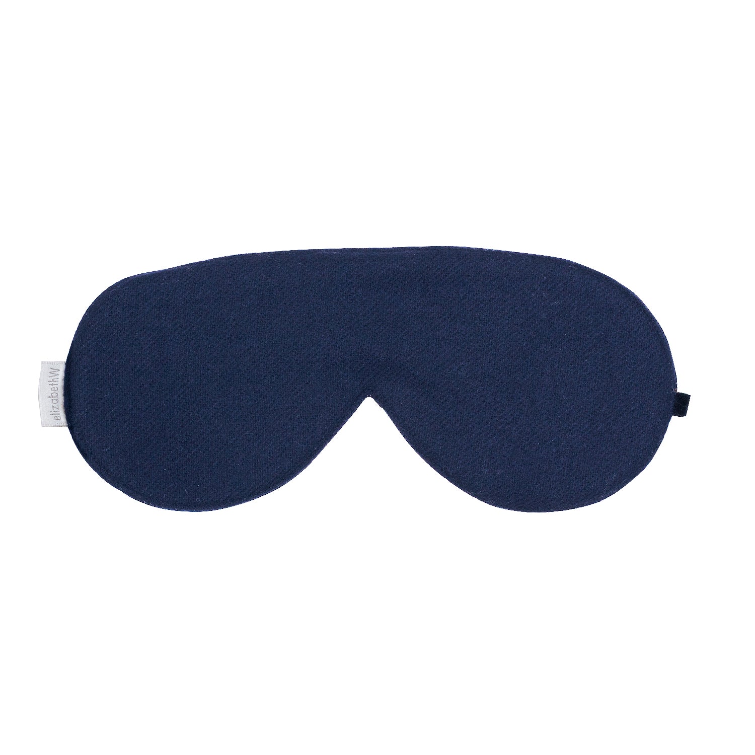 The Wool Navy Sleep Mask by elizabethW features a simple, curved design and a small white label on the left side. With an adjustable velvet strap and a silk underside, this mask appears soft and comfortable, making it ideal for blocking light to promote restful sleep.