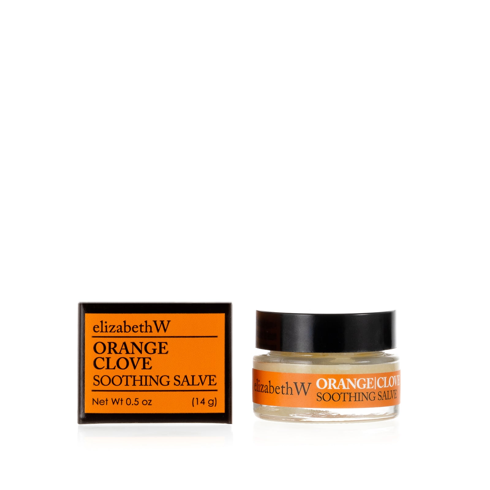 .5 oz (14g) glass jar of Orange Clove Soothing Salve with a matching orange and black box. The jar contains salve, and the box displays the product name and the brand elizabethW in black text on a orange background.