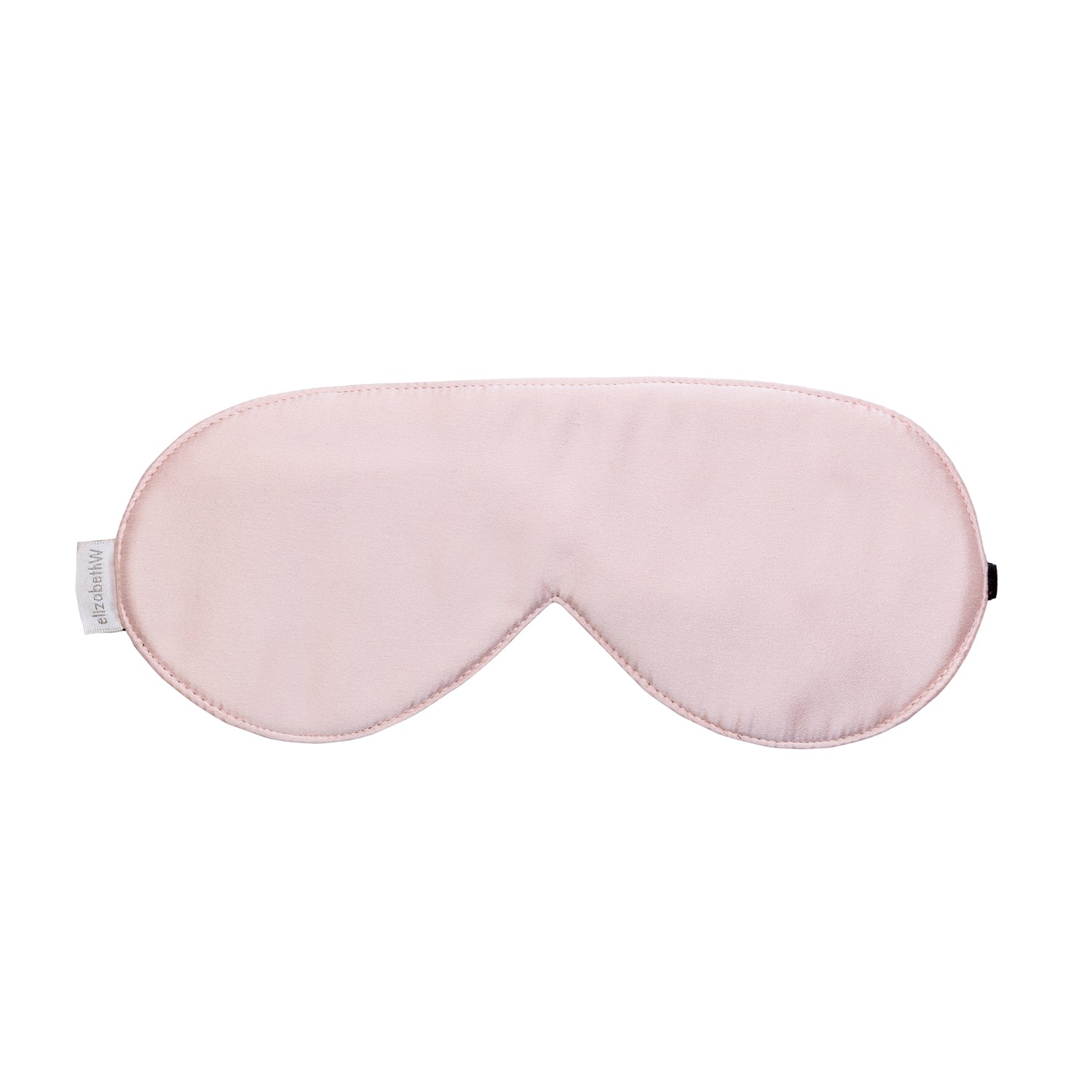 The Pink Sleep Mask by elizabethW is a light pink sleep mask crafted from luxurious silk, with a smooth satin finish. It includes adjustable strap to ensure it secures comfortably around your head for a restful sleep.