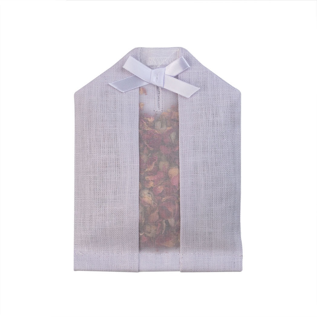 Dried rose petals filled inside of a purple linen hanger sachet 