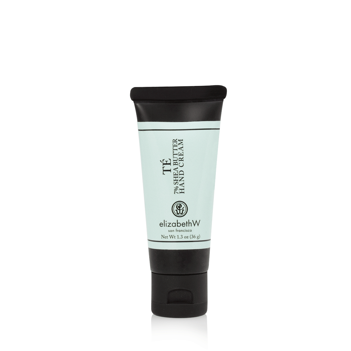 A 1.3 oz (36 g) teal-colored tube of TE hand cream with a black cap and black text. The label reads "TE 7% Shea Butter Hand Cream," with the elizabethW logo and "san francisco" beneath it. The net weight of the product is also listed on the label.